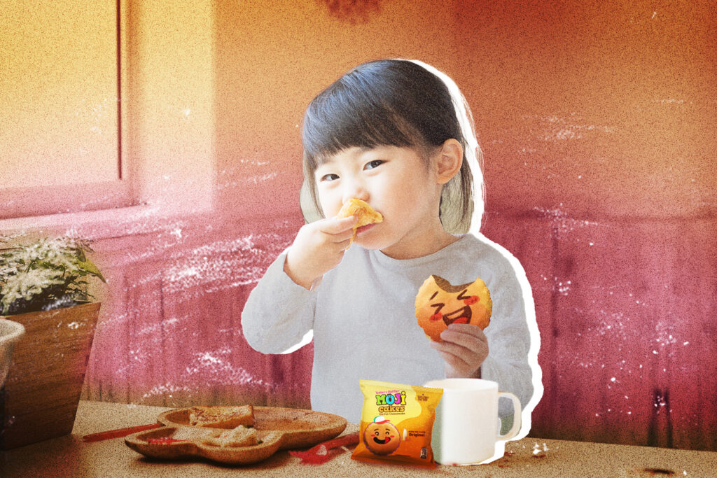child eating Moji cakes