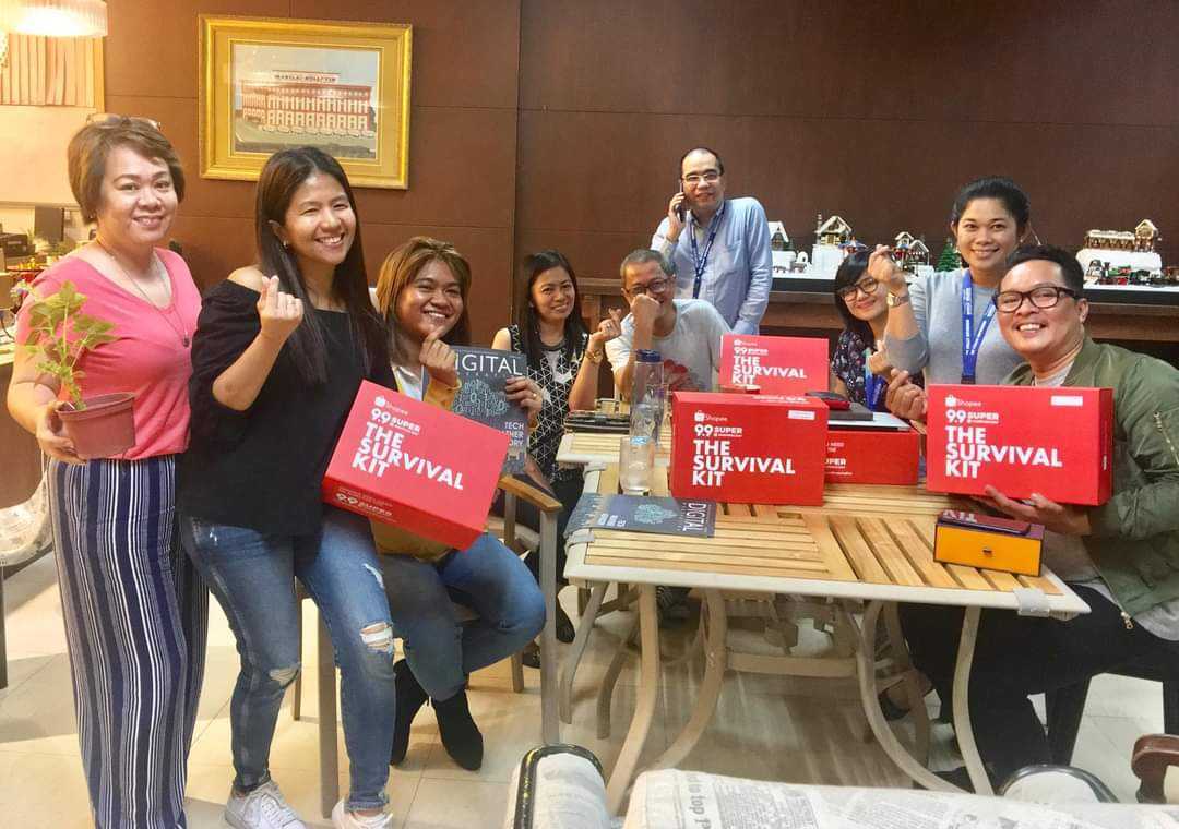 Shyla with media guests holding the Shopee 9.9 super shopping day Survival Kit.
