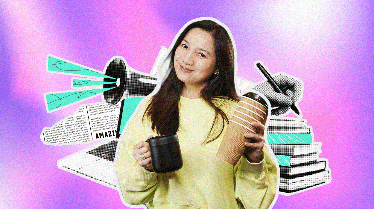 Catherine Llanto, M2.0 Communications’ Content Director, smiling with two coffee cups, surrounded by creative elements like books, a megaphone, and a laptop.