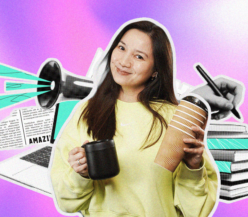 Catherine Llanto, M2.0 Communications’ Content Director, smiling with two coffee cups, surrounded by creative elements like books, a megaphone, and a laptop.